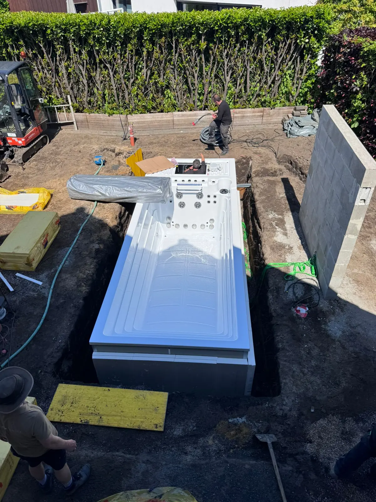 INFINITAS swim spa being installed in the pit – construction phase