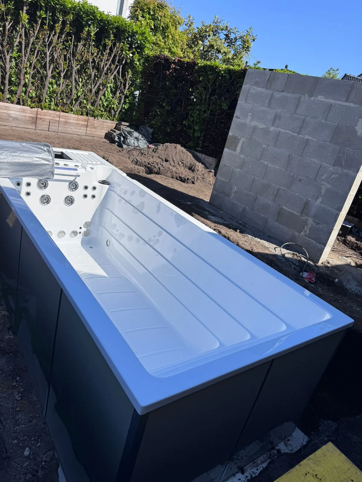INFINITAS swim spa in the pit before backfilling
