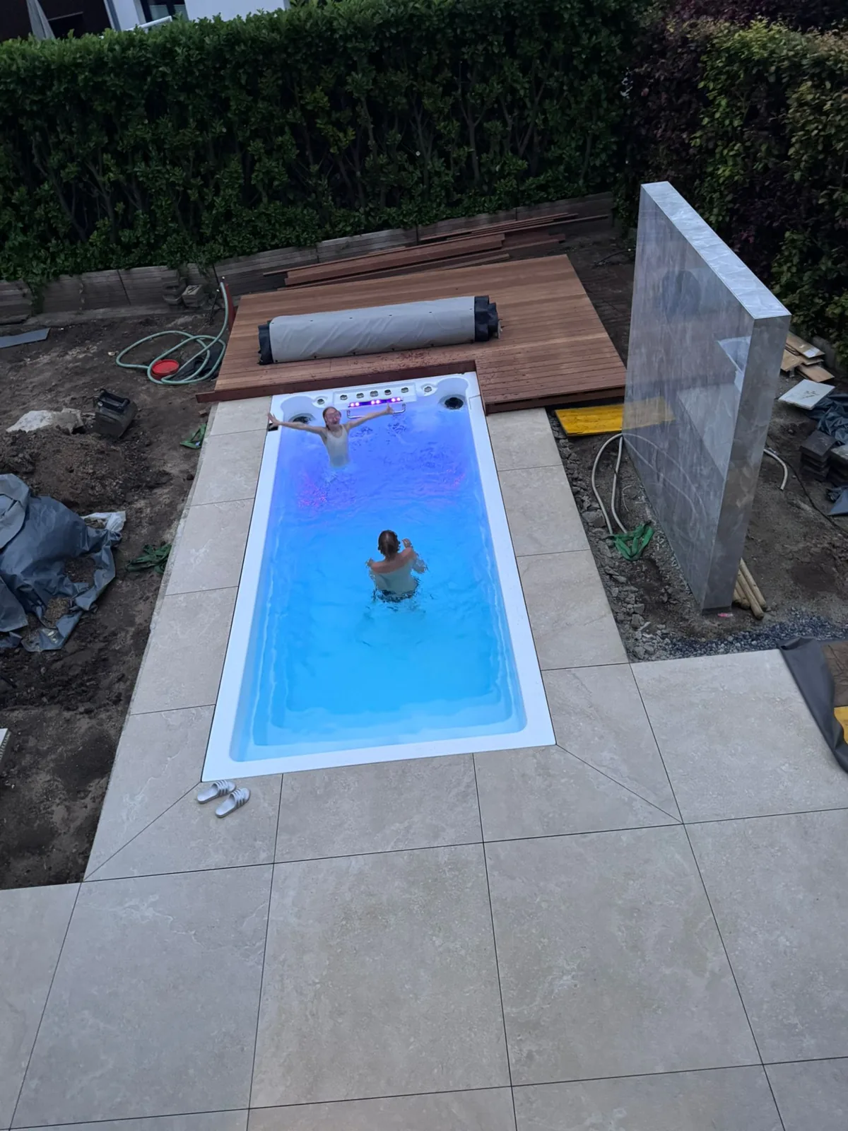 INFINITAS swim spa fully inground – terrace slabs being laid